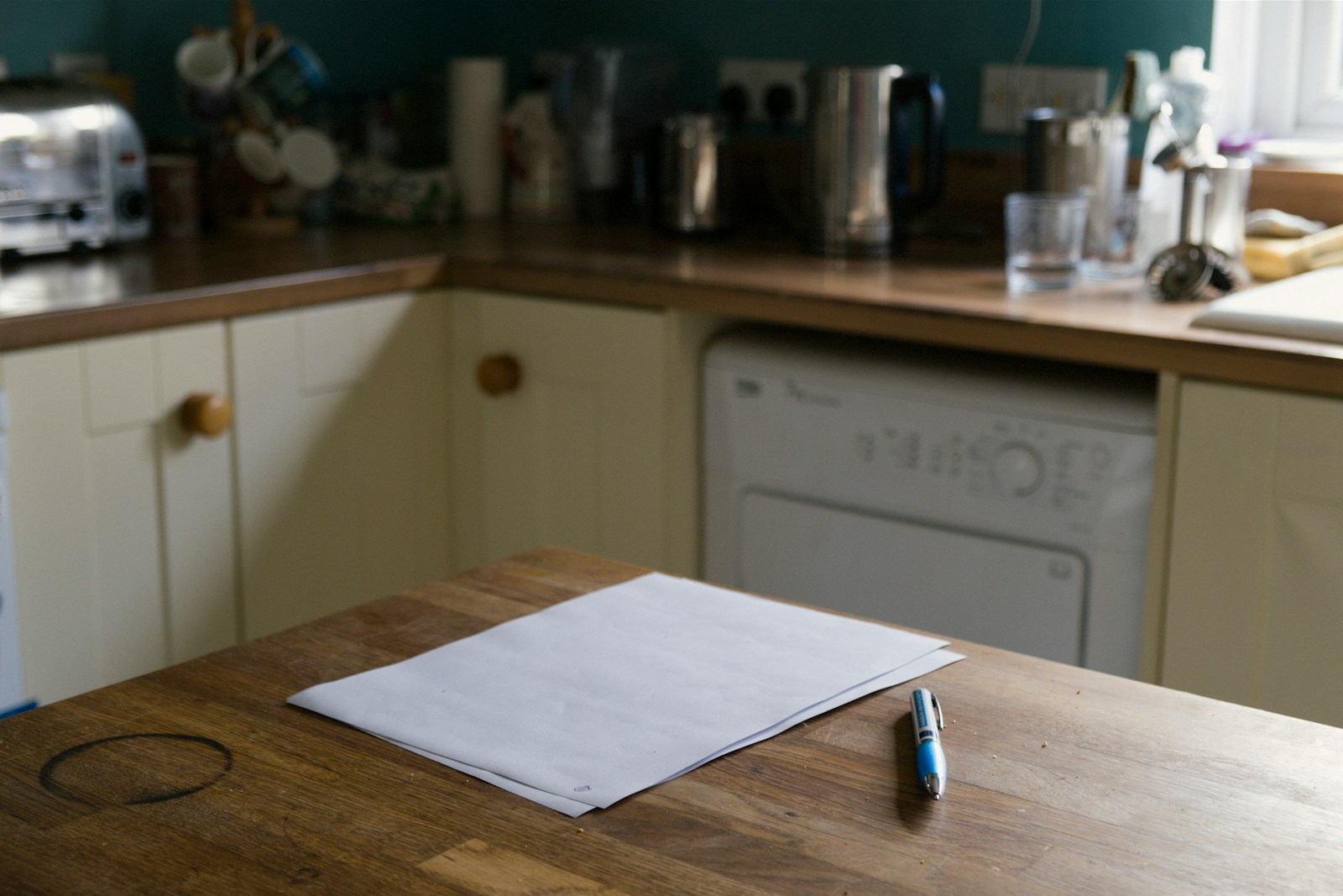 Quote paperwork on a kitchen counter before a plumbing job