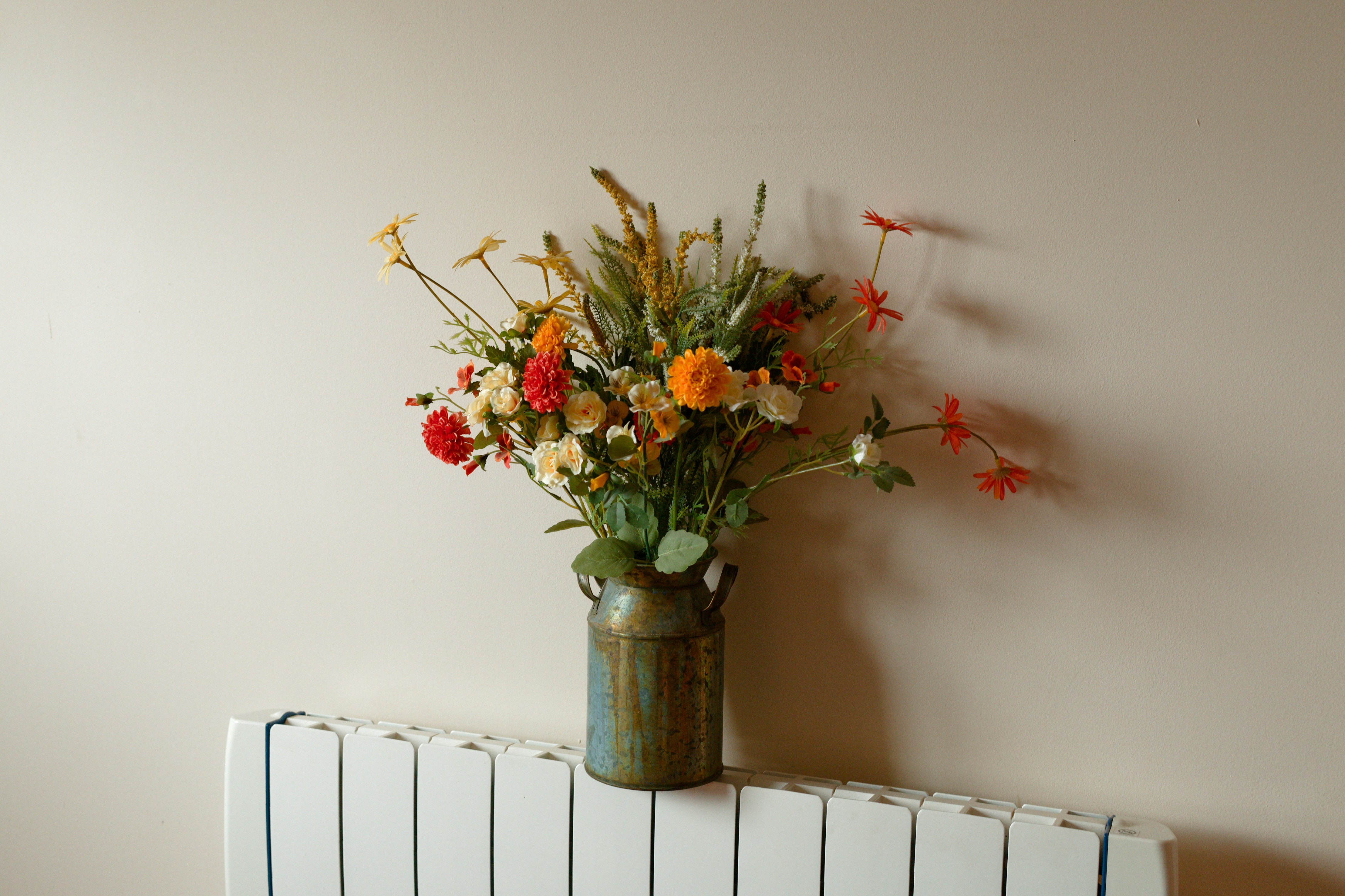 After: new white panel radiator fitted in the same pre-war apartment