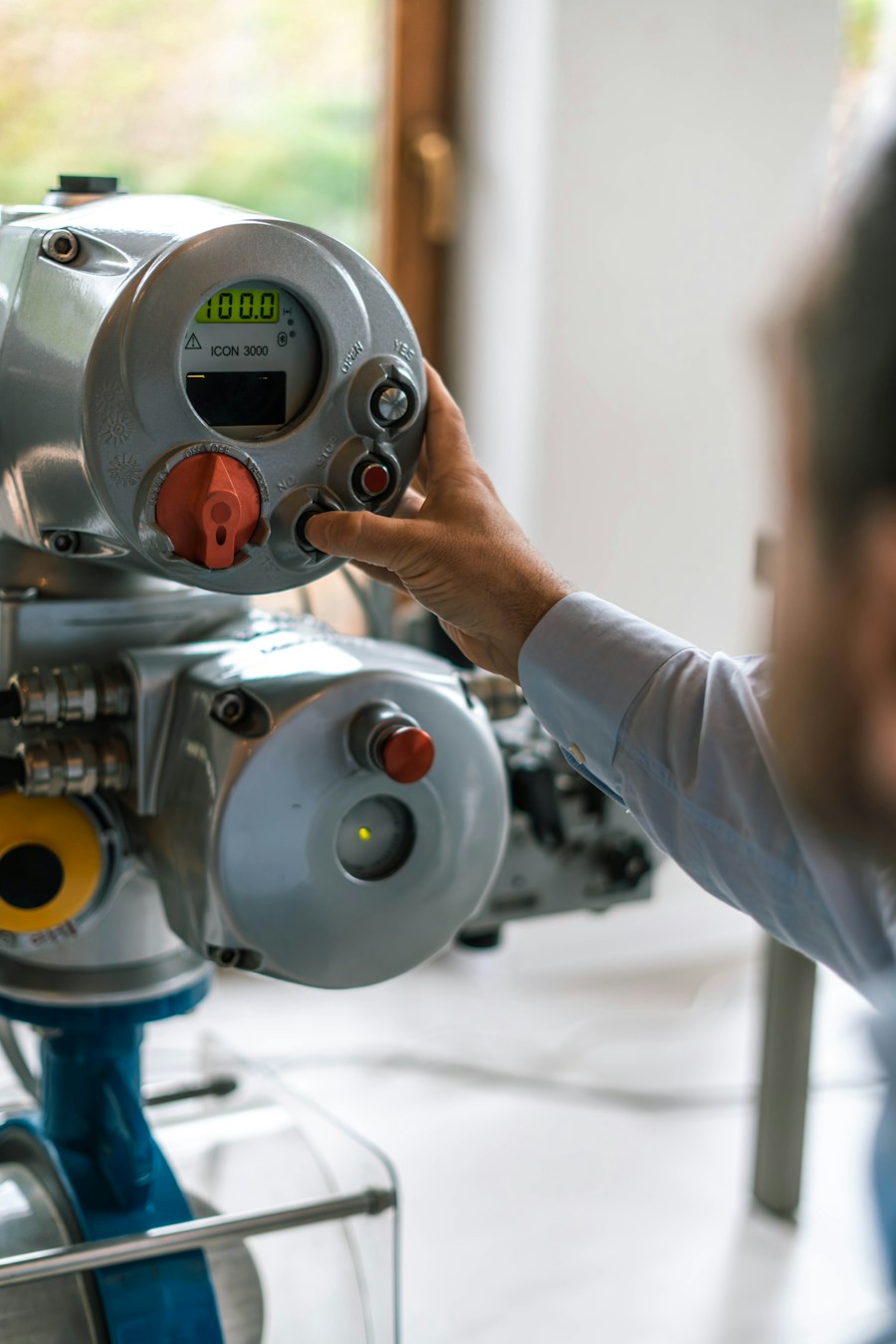 Heating technician adjusting the control head on a boiler valve