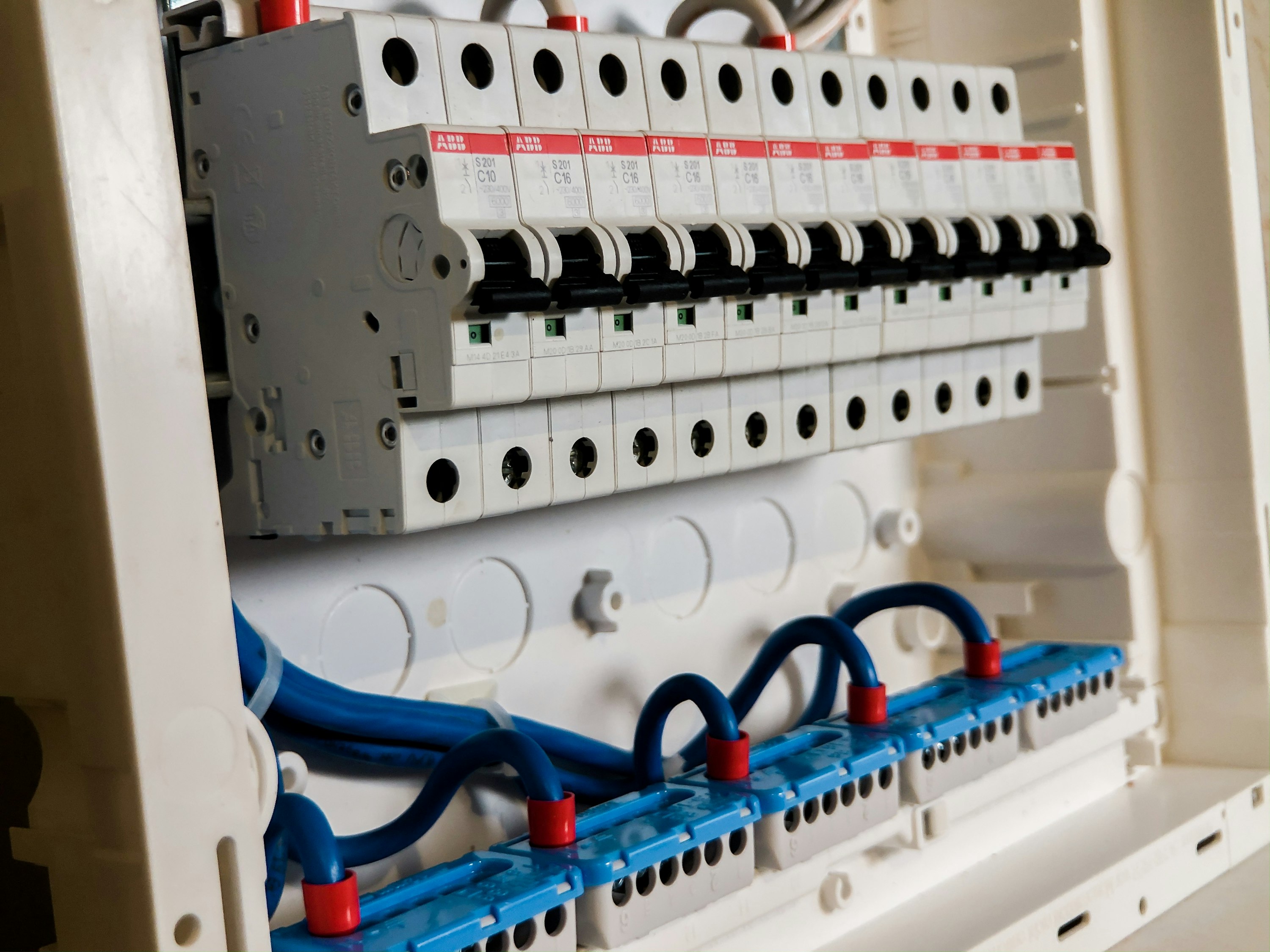 After: new circuit breakers and busbar wiring in the replaced electrical panel