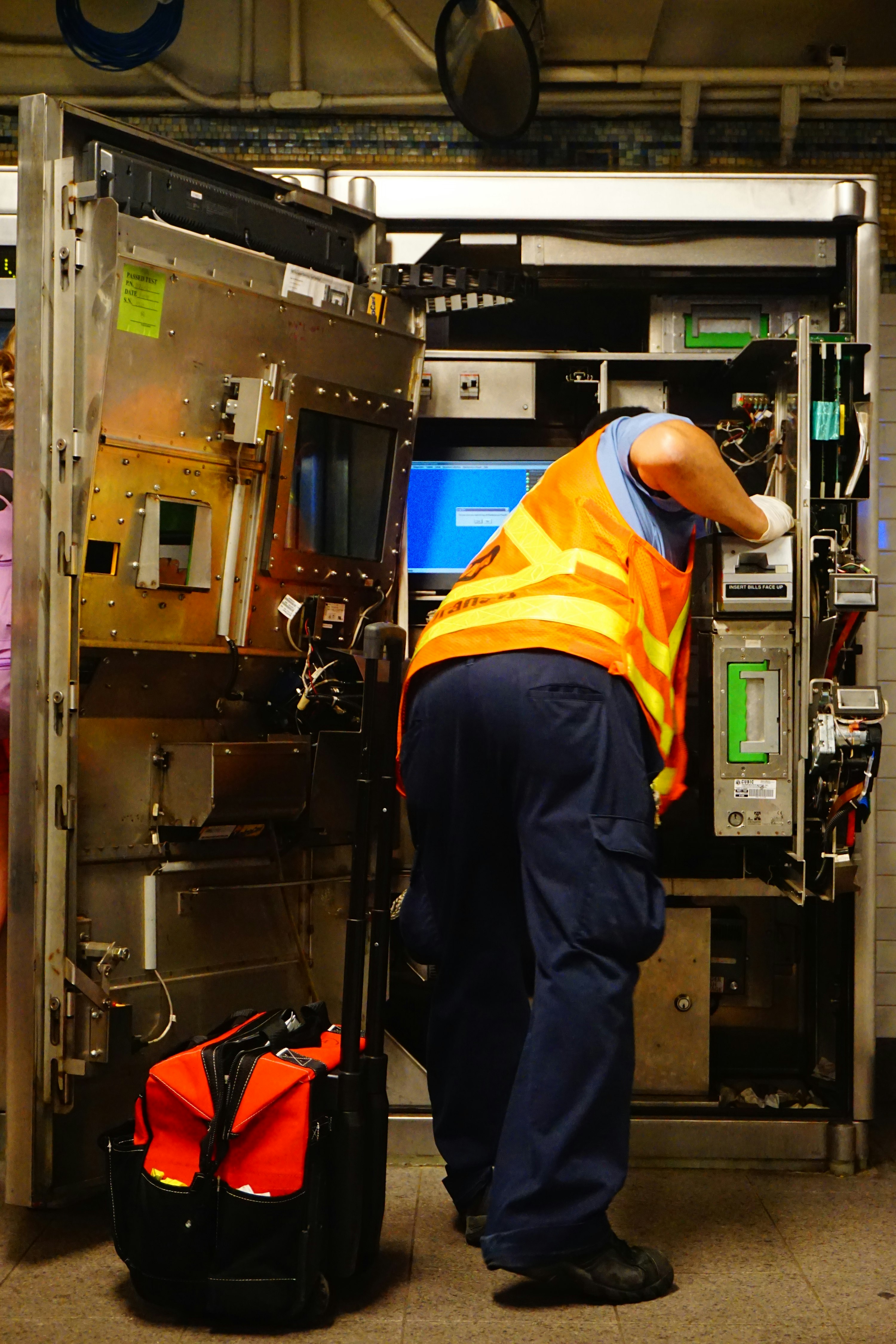 Heating technician checking the control panel on a boiler
