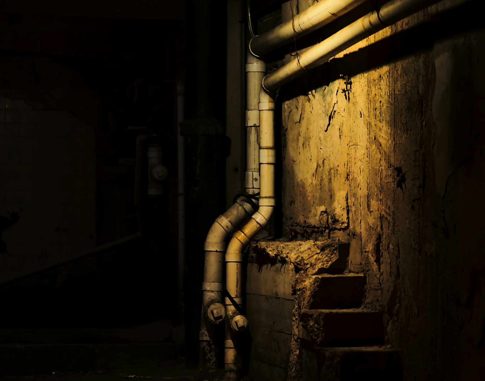 Copper heating pipes and valves in a basement boiler room